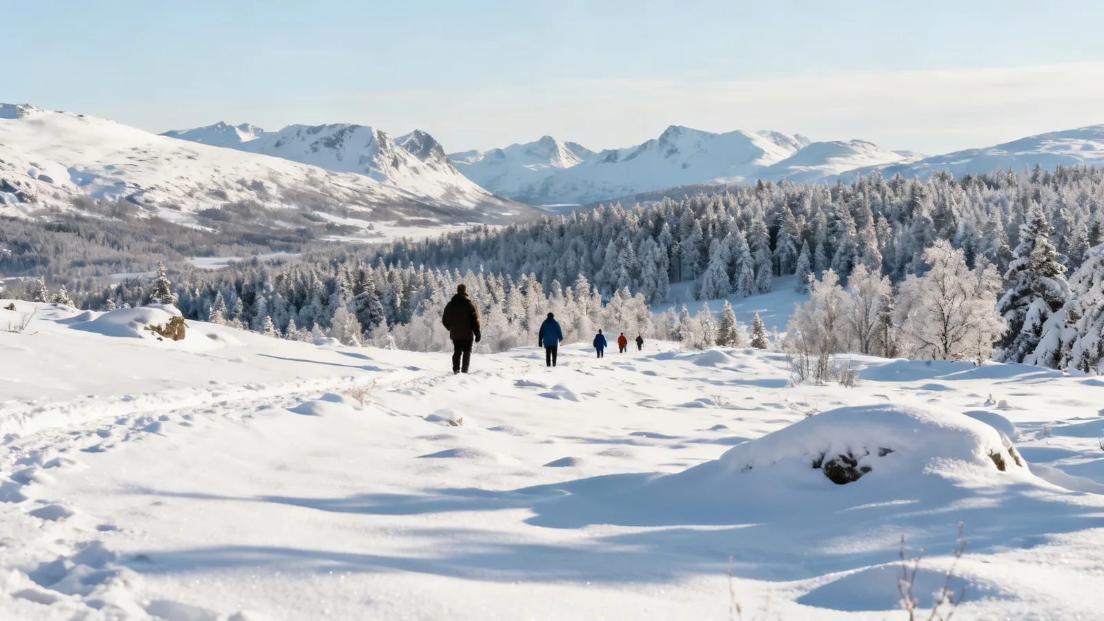 Travellers beside snow-covered hills